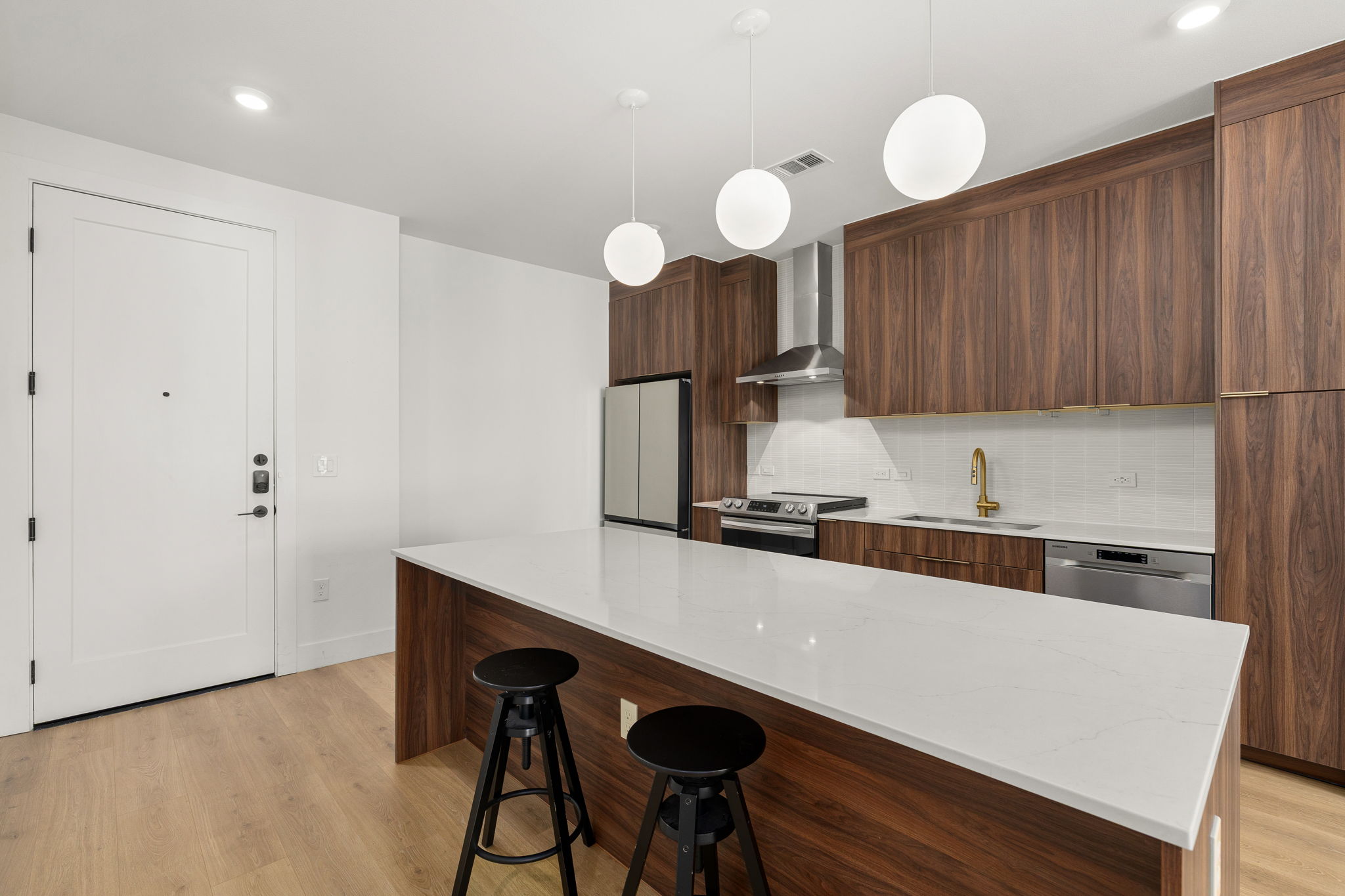 1701 Simond Avenue, Unit 612 Austin, TX 78723 - Photo 9 of 40 a kitchen with a table and chairs in it