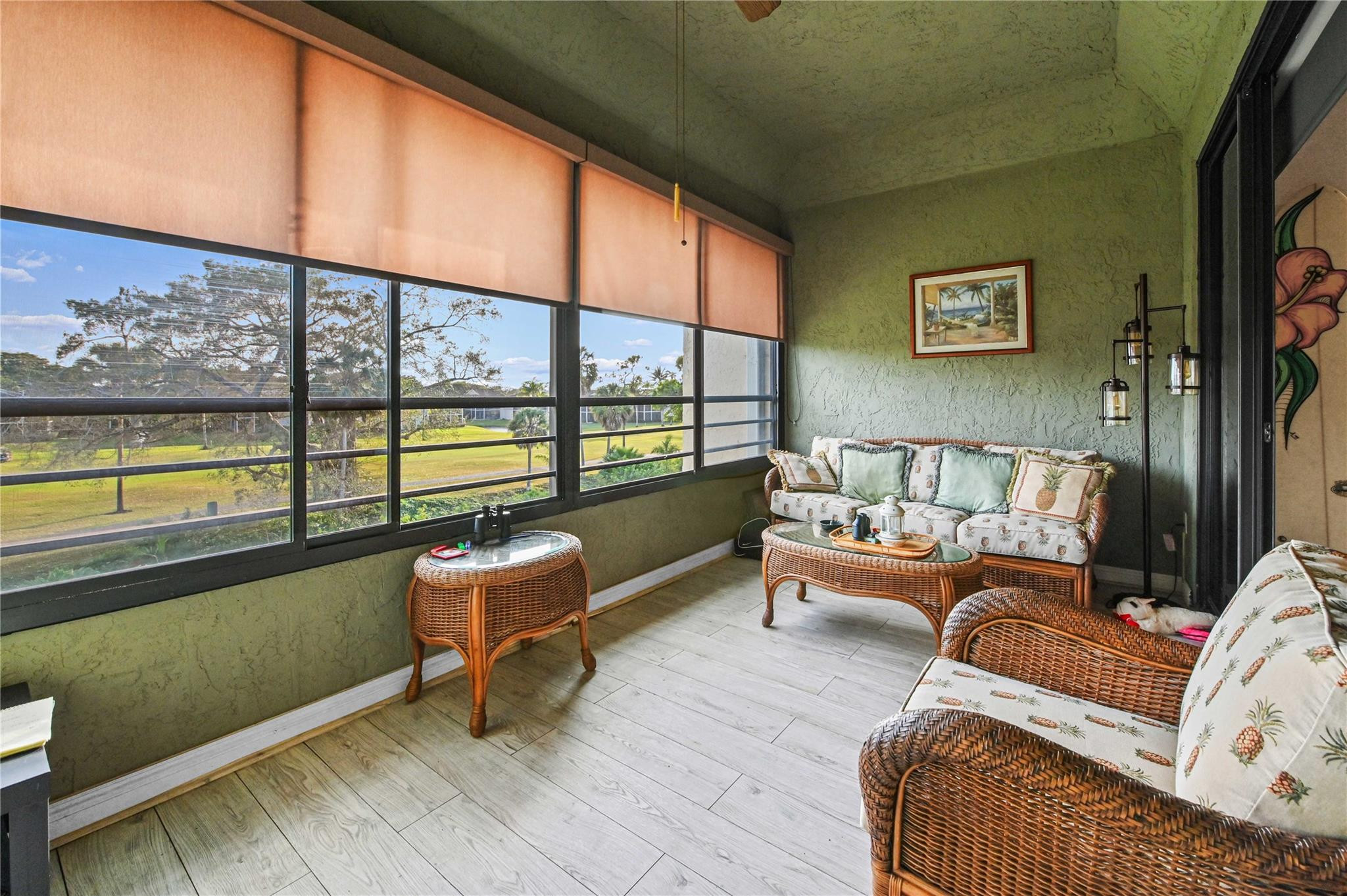 7520 La Paz Boulevard, Unit 306 Boca Raton, FL 33433 - Photo 14 of 36 a living room with furniture and a large window