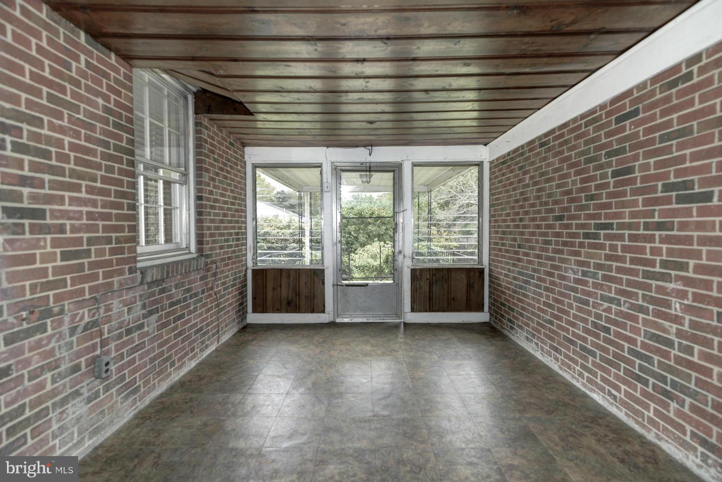 4879 Montgomery Road Ellicott City, MD 21043 - Photo 22 of 25 Exposed Brick Sun Porch