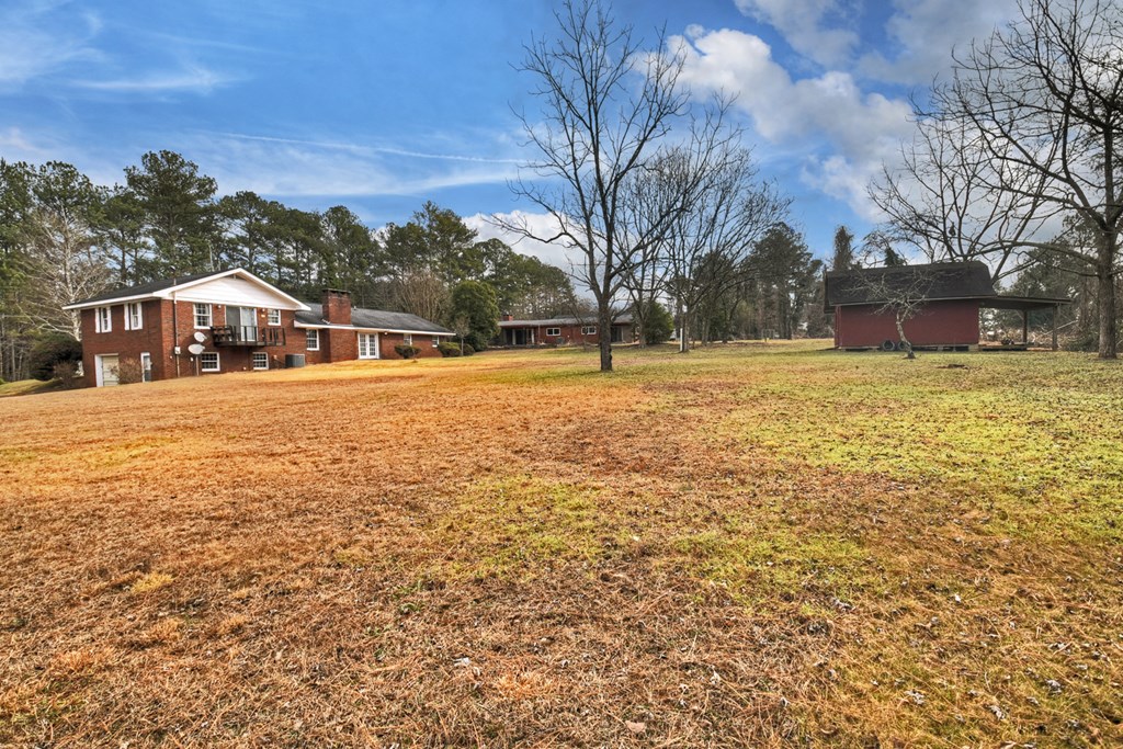 330 Colonial Avenue Copperhill, TN 37317 - Photo 12 of 37 a view of a yard with a house in the background