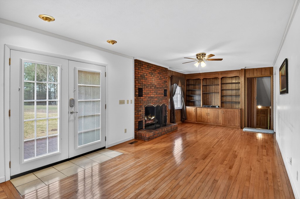 330 Colonial Avenue Copperhill, TN 37317 - Photo 16 of 37 a view of a livingroom with a fireplace wooden floor and window