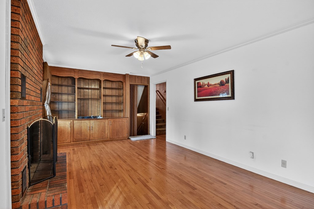 330 Colonial Avenue Copperhill, TN 37317 - Photo 18 of 37 a view of a livingroom with wooden floor and a ceiling fan