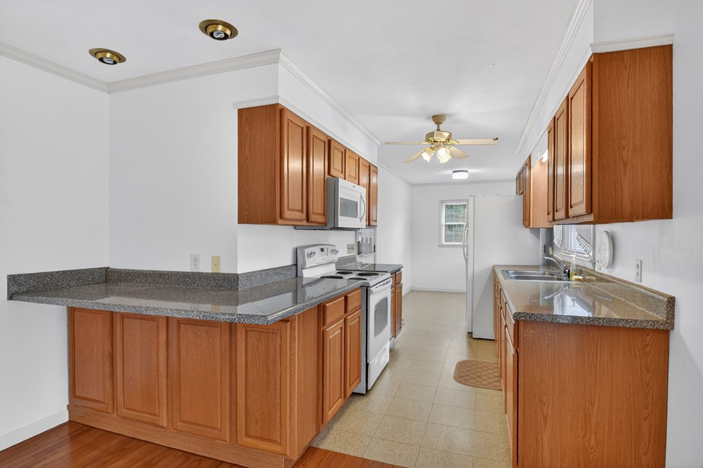 330 Colonial Avenue Copperhill, TN 37317 - Photo 20 of 37 a kitchen with stainless steel appliances granite countertop a sink stove and cabinets