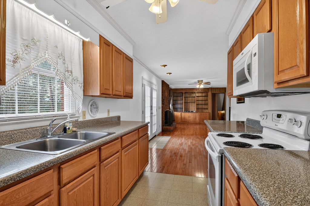 330 Colonial Avenue Copperhill, TN 37317 - Photo 22 of 37 a kitchen with stainless steel appliances granite countertop a sink stove and cabinets