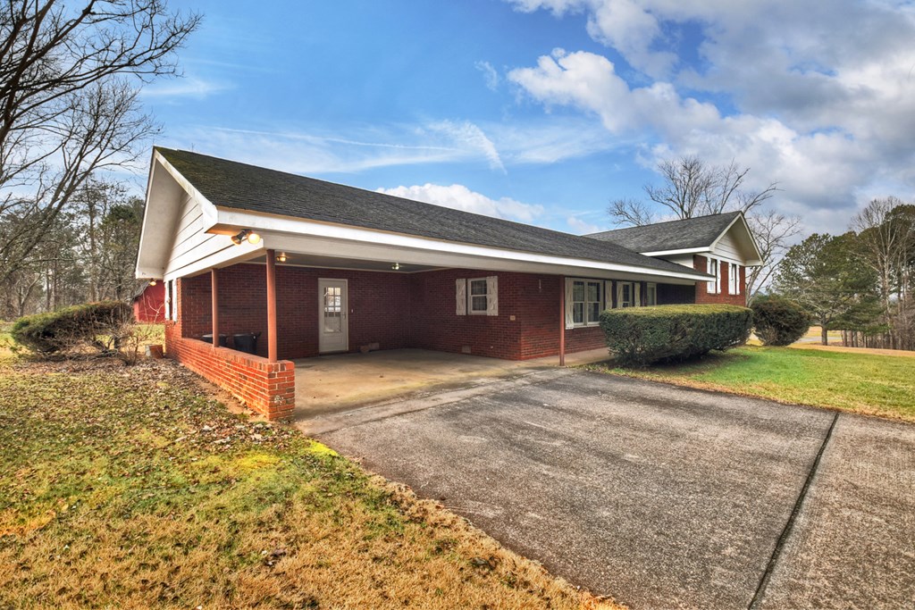 330 Colonial Avenue Copperhill, TN 37317 - Photo 3 of 37 a front view of a house with a yard and garage