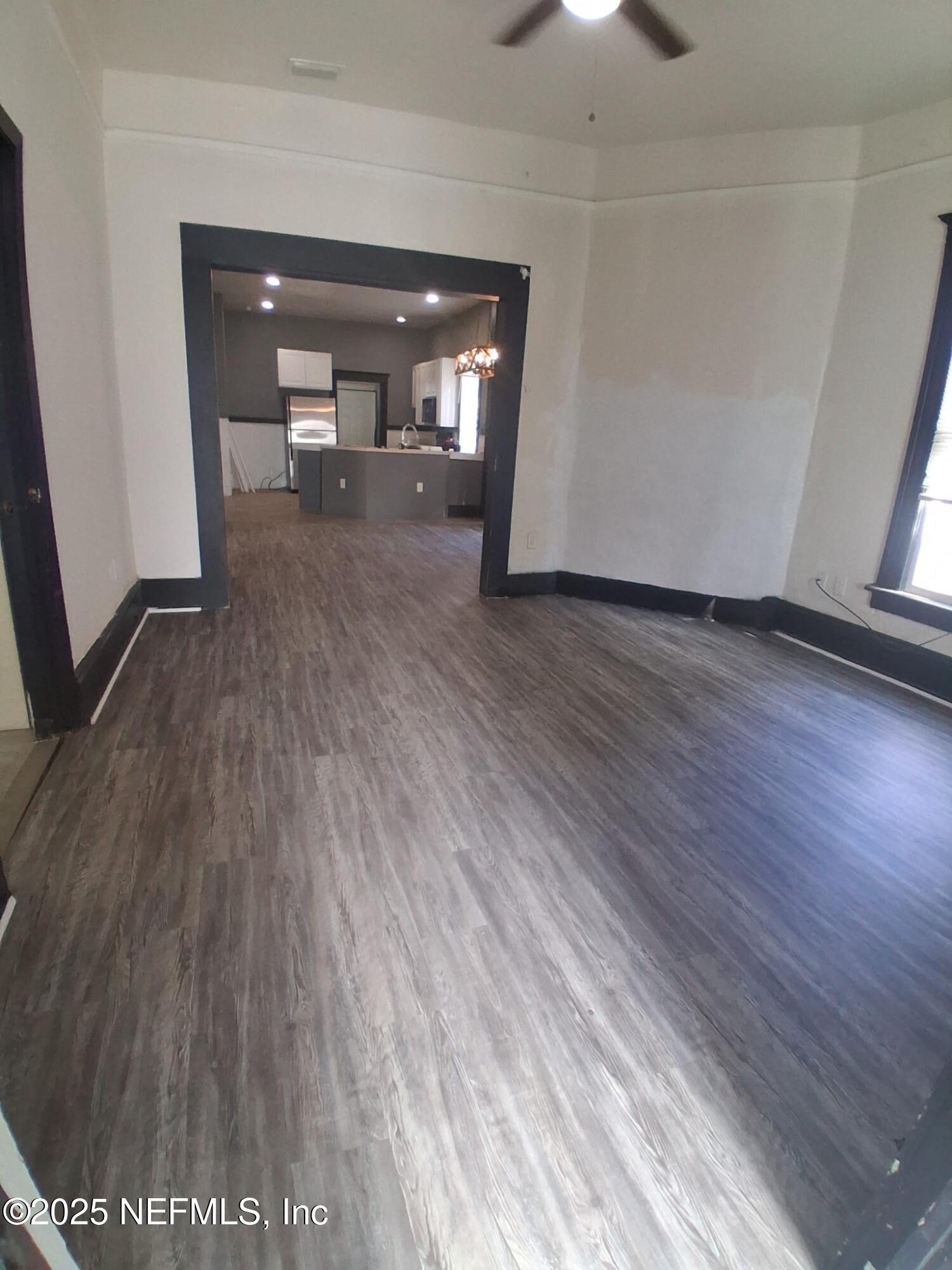 2005 Morehouse Road Jacksonville, FL 32209 - Photo 2 of 14 wooden floor in an empty room with a window