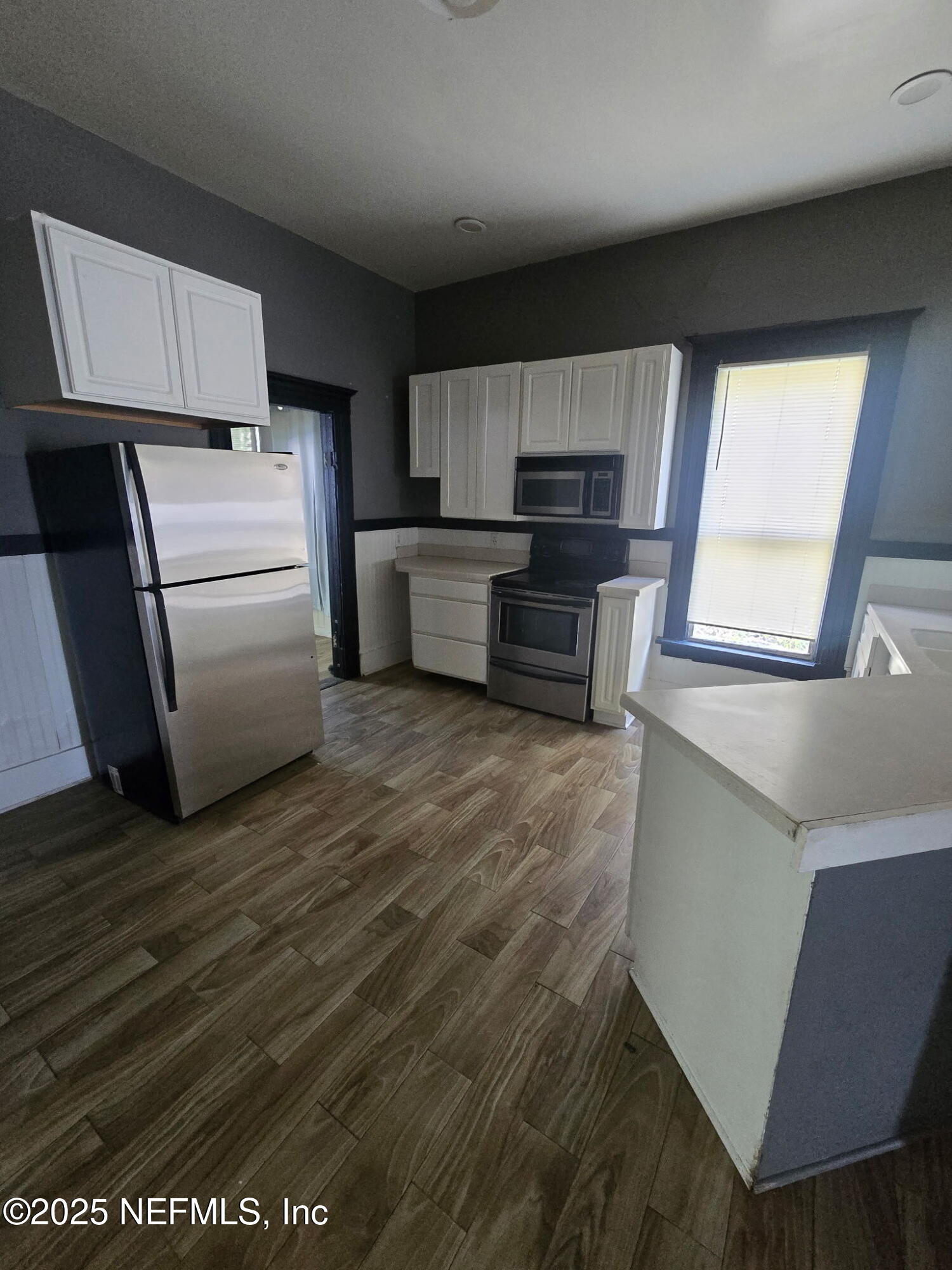 2005 Morehouse Road Jacksonville, FL 32209 - Photo 4 of 14 a kitchen with granite countertop a refrigerator and a sink