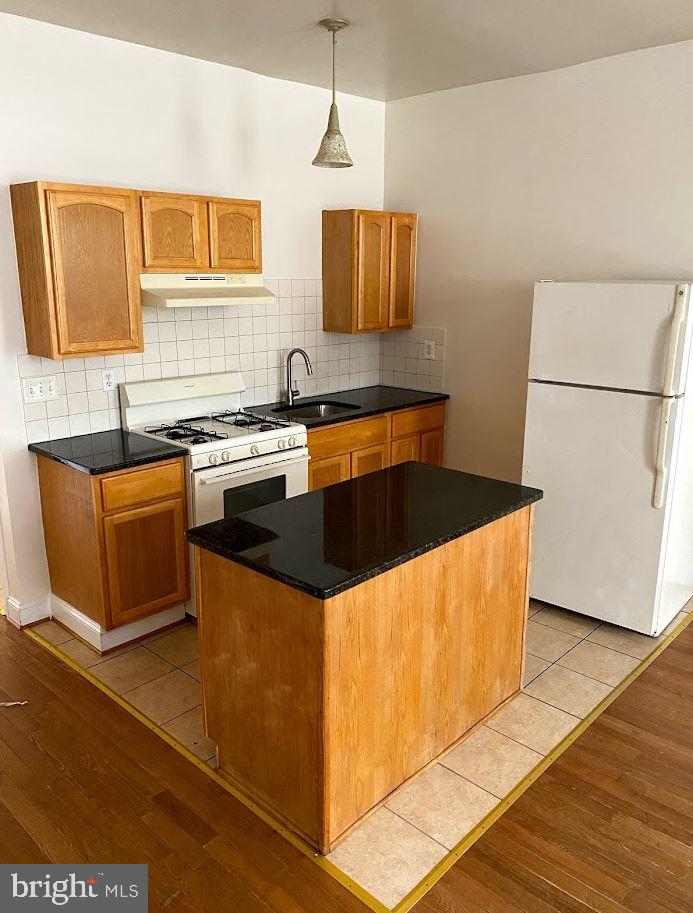 a kitchen with stainless steel appliances granite countertop a sink counter space and cabinets