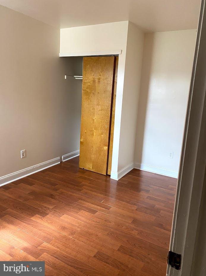 1134 West Nevada Street Philadelphia, PA 19133 - Photo 8 of 12 an empty room with wooden floor and closet
