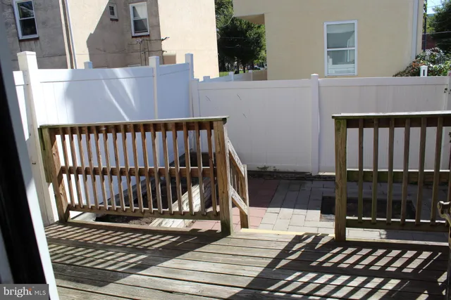 a view of a wooden roof deck