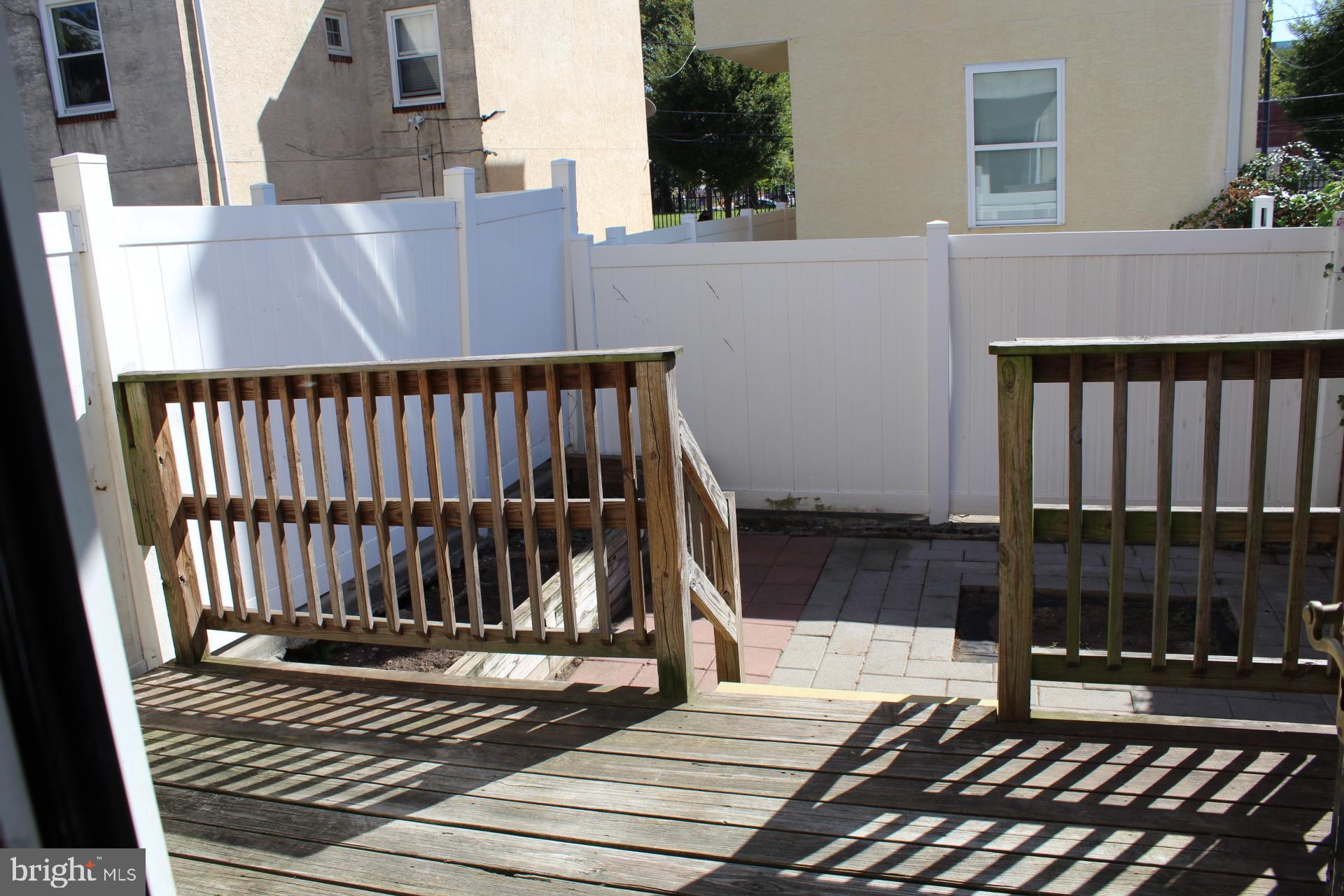 1134 West Nevada Street Philadelphia, PA 19133 - Photo 9 of 12 a view of a wooden roof deck