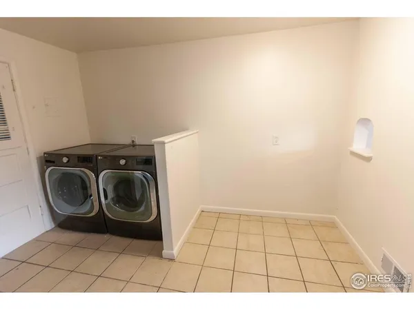 a view of a storage & utility room with washer and dryer