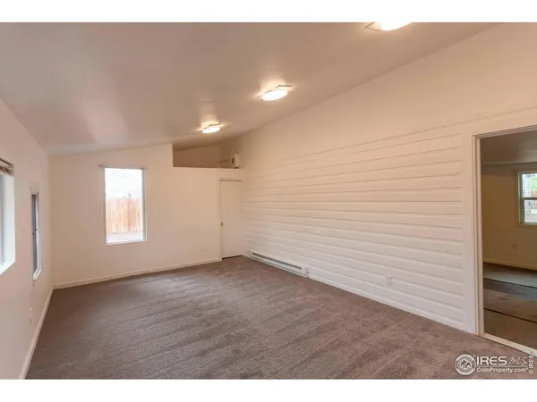 a view of an empty room and window