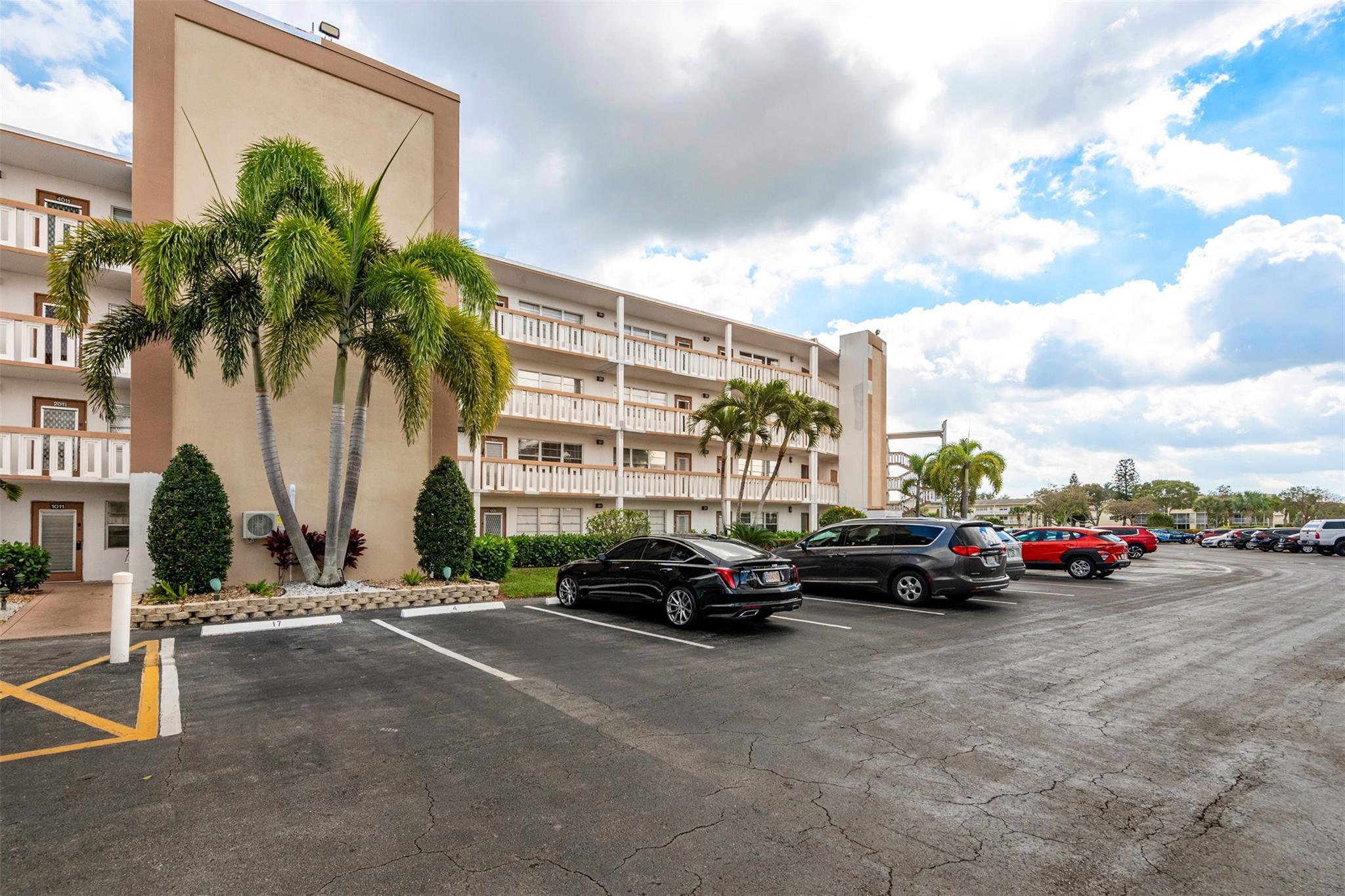 2009 Cornwall Drive, Unit 2009 Boca Raton, FL 33434 - Photo 2 of 23 a car parked in front of a building