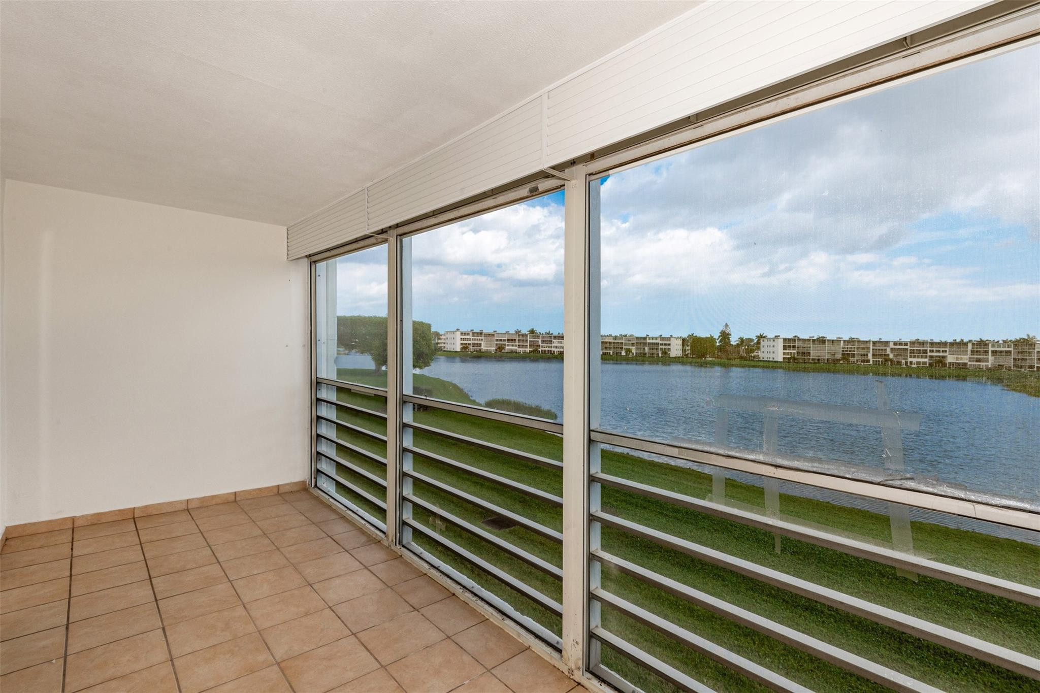 2009 Cornwall Drive, Unit 2009 Boca Raton, FL 33434 - Photo 21 of 23 a view of a balcony with lake view and mountain view