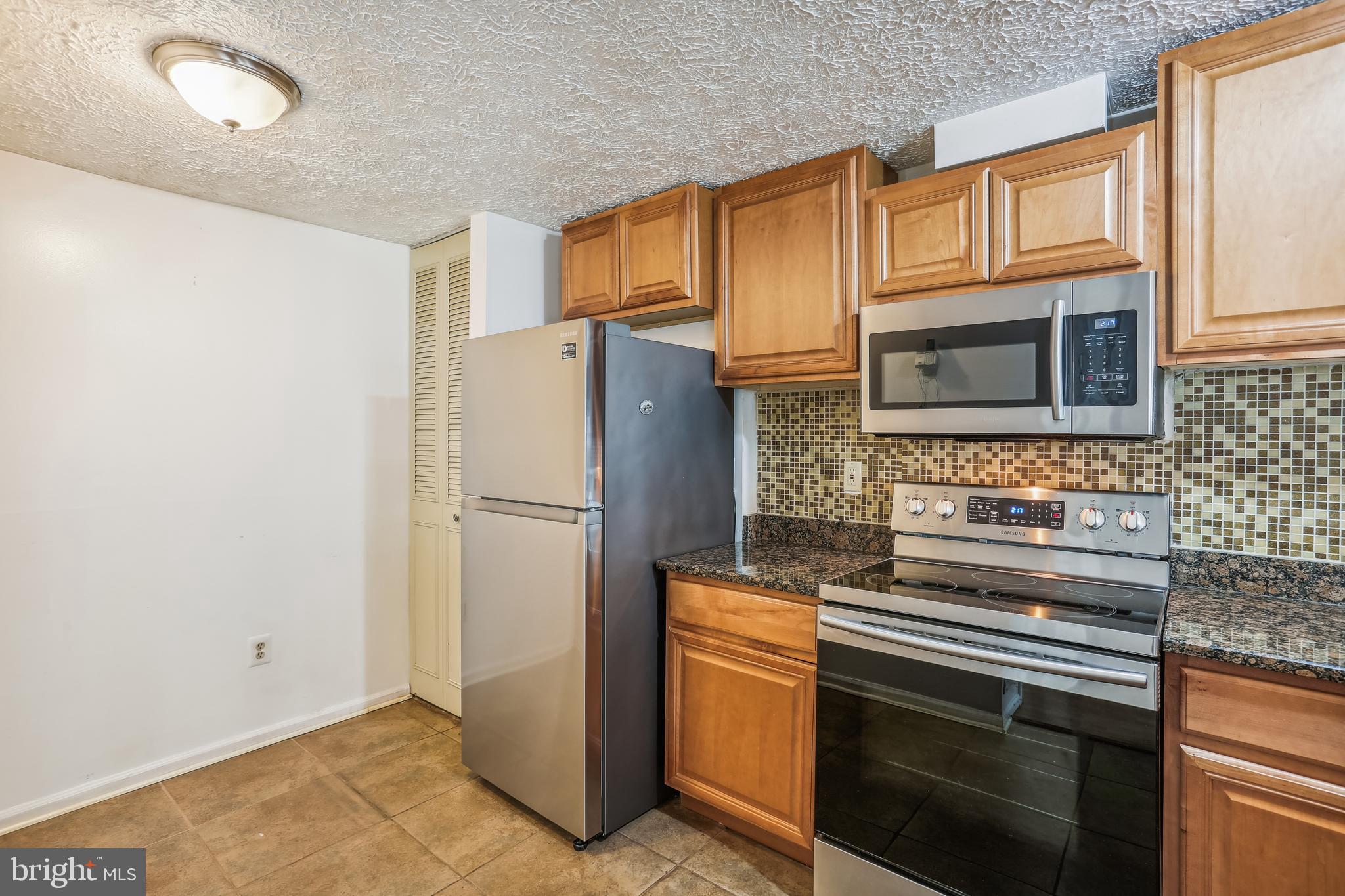 416 Legato Terrace Silver Spring, MD 20901 - Photo 11 of 32 Kitchen with Stainless Steel Appliance
