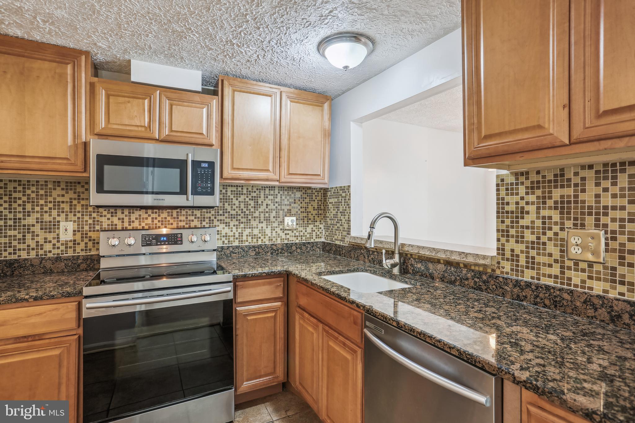 416 Legato Terrace Silver Spring, MD 20901 - Photo 12 of 32 Kitchen with Stainless Steel Appliance