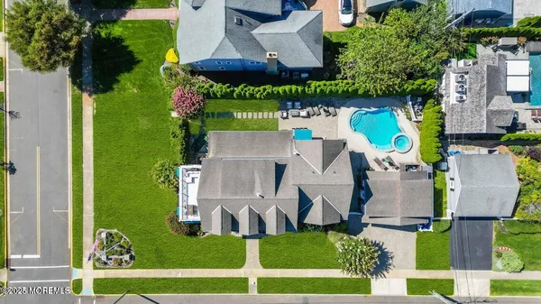 a kitchen with lot of cabinets and stainless steel appliances