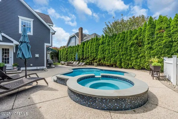 a picture of a bathroom with sink and mirror