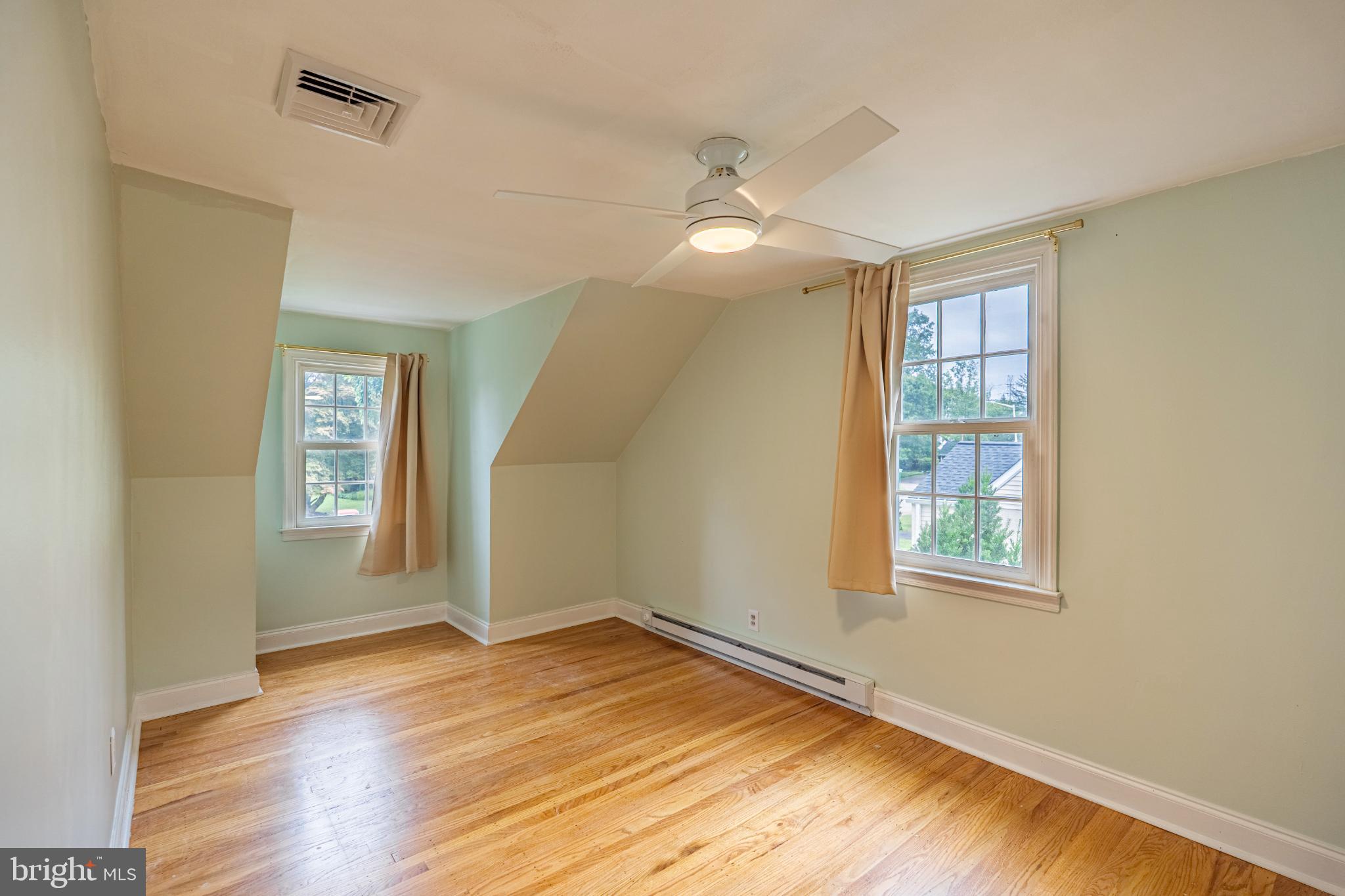 604 Arlingham Road Flourtown, PA 19031 - Photo 27 of 30 an empty room with wooden floor and windows