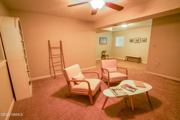 a group of chairs sitting in a room next to a window