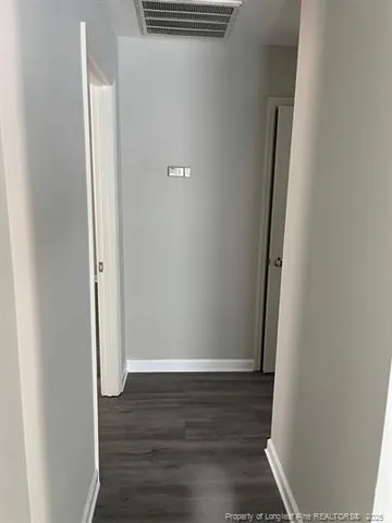 an empty room with wooden floor