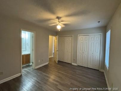 1189 Landau Road Fayetteville, NC 28311 - Photo 10 of 17 an empty room with wooden floor and windows