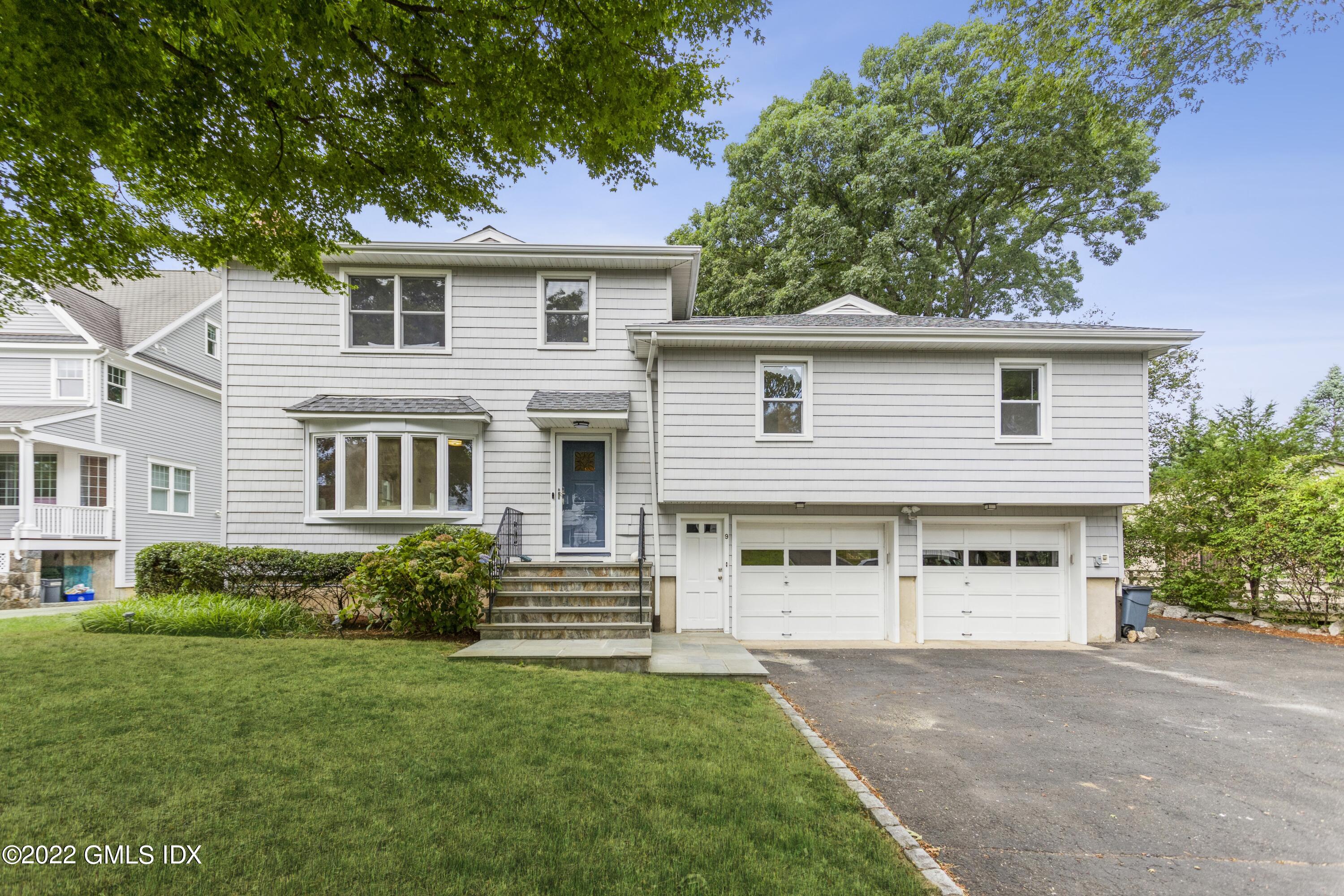 front view of a house with a yard