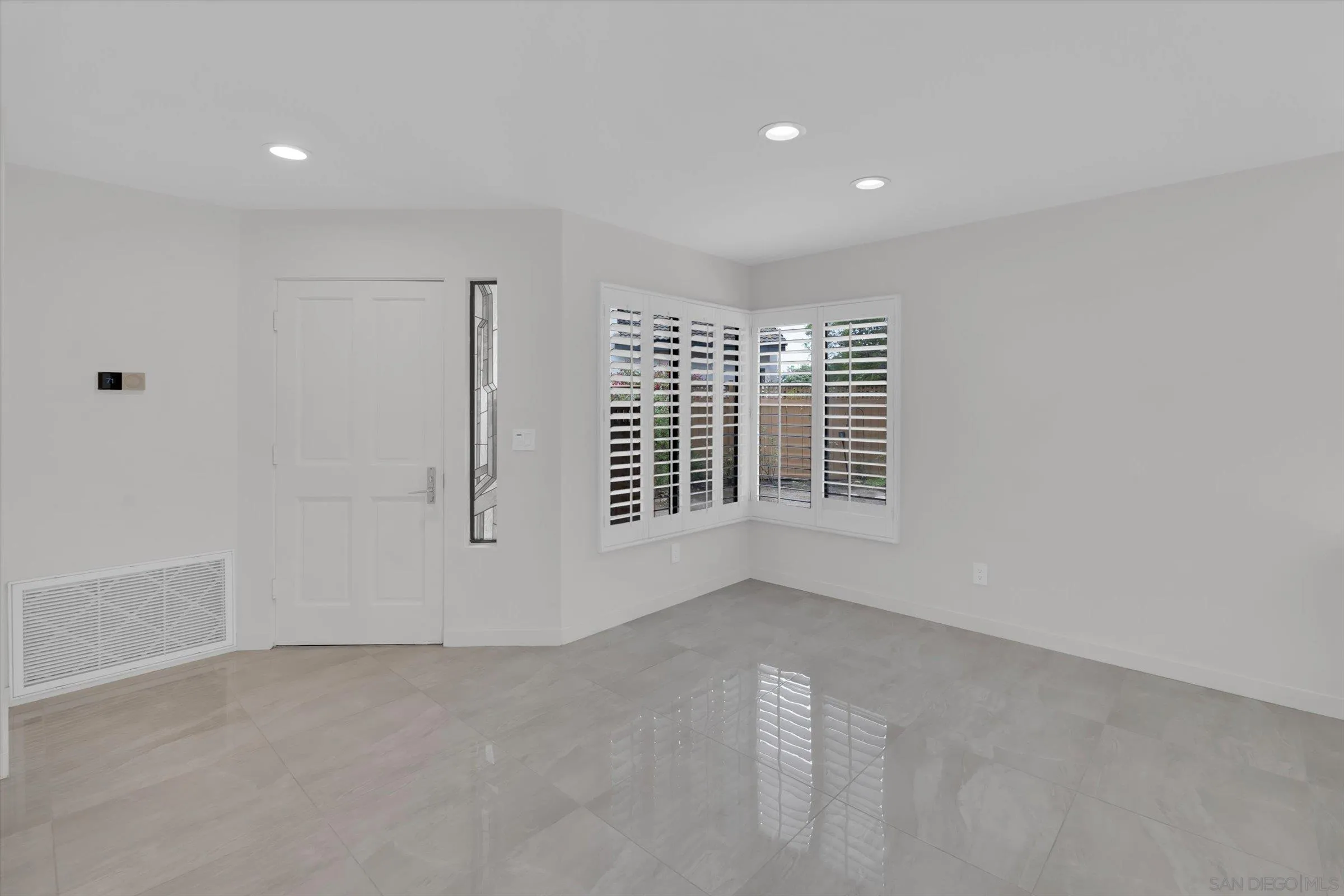 6426 Caminito Listo San Diego, CA 92111 - Photo 12 of 48 a view of an empty room with a window