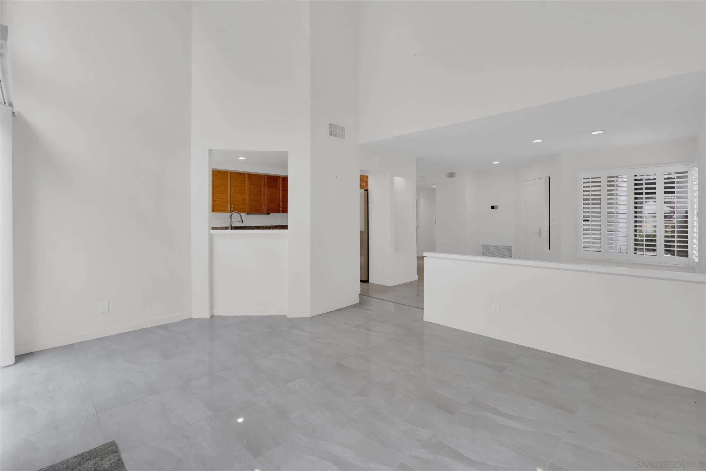 6426 Caminito Listo San Diego, CA 92111 - Photo 17 of 48 a view of an empty room with a window