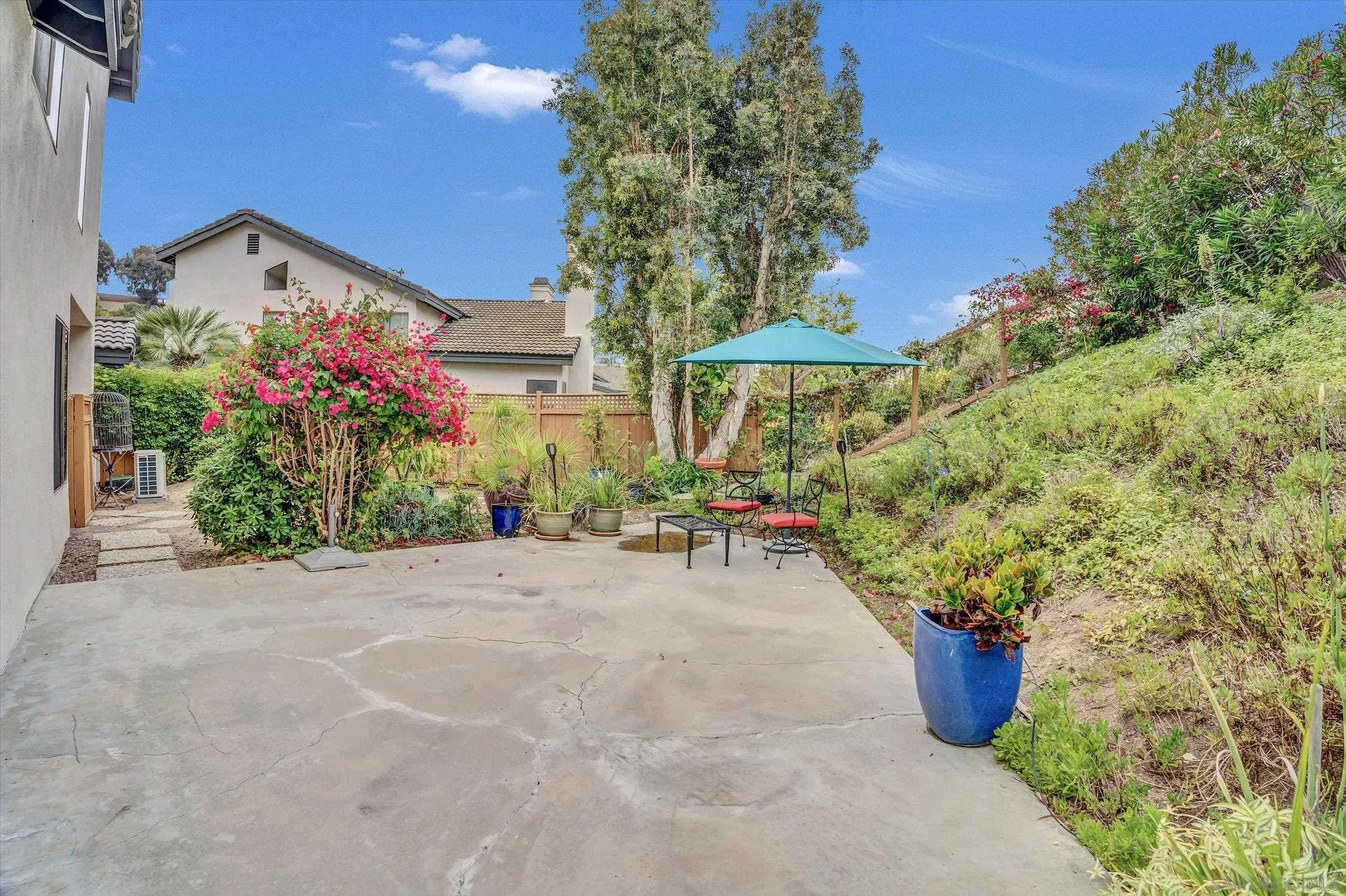 6426 Caminito Listo San Diego, CA 92111 - Photo 2 of 48 a view of a backyard with plants and a garden
