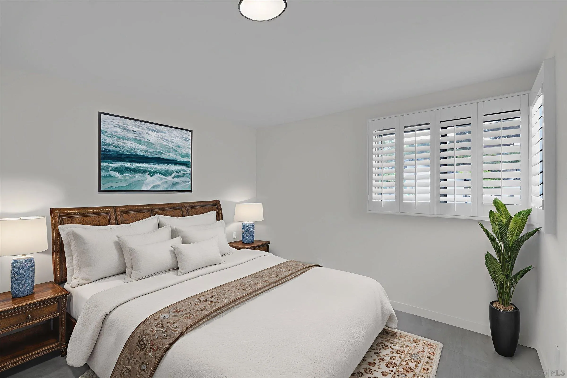 6426 Caminito Listo San Diego, CA 92111 - Photo 22 of 48 a bedroom with bed and a potted plant