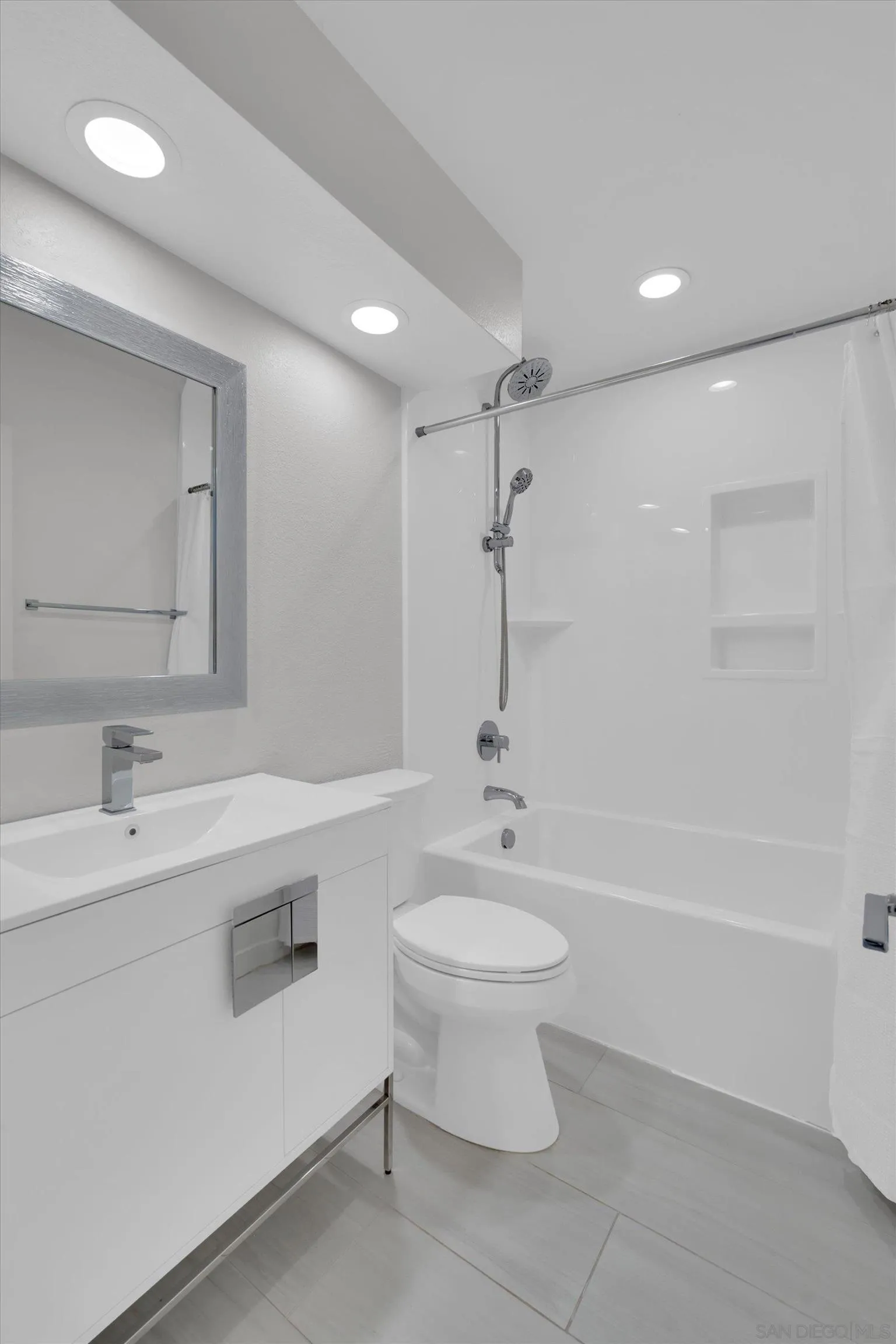 6426 Caminito Listo San Diego, CA 92111 - Photo 27 of 48 a bathroom with a sink toilet and shower