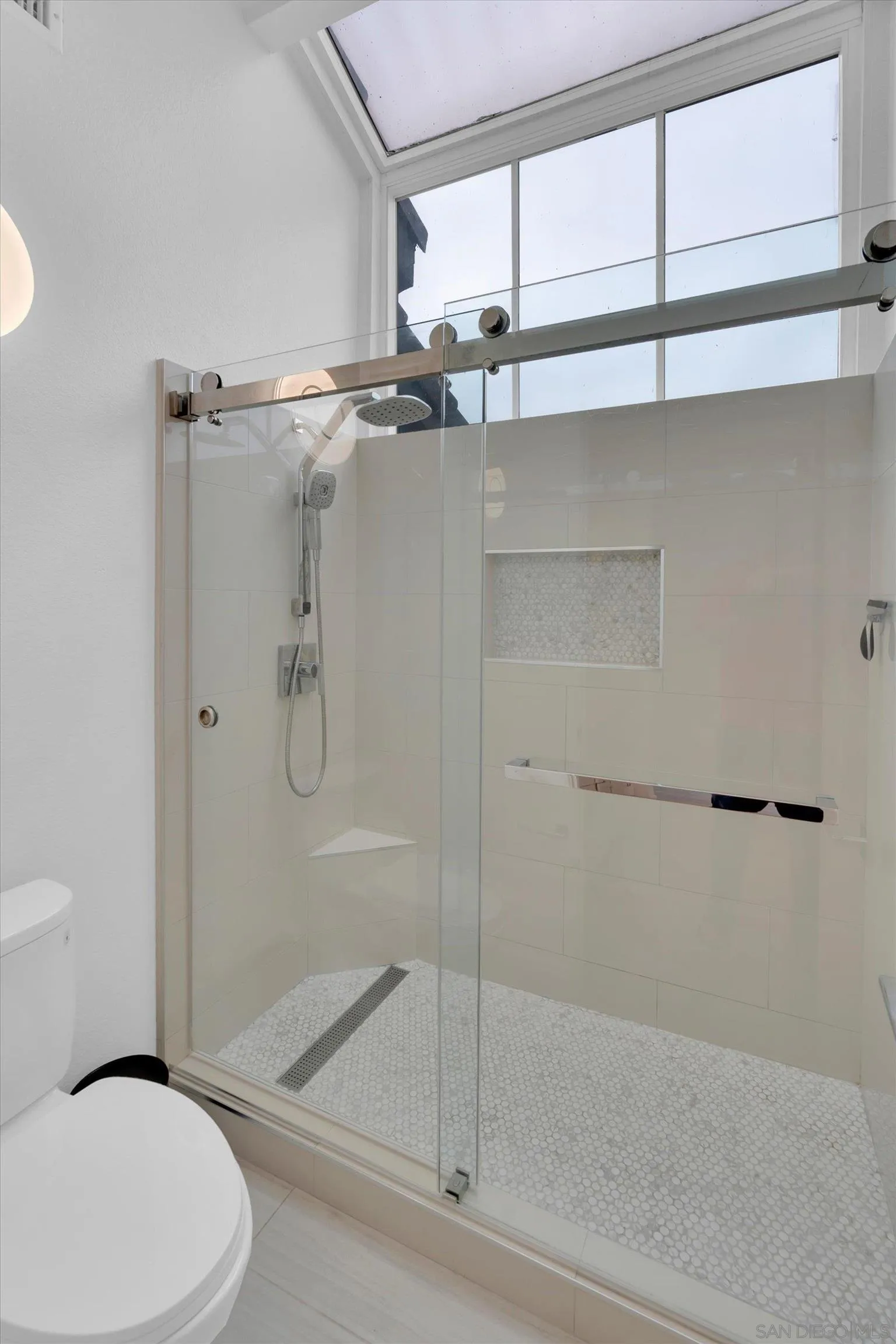 6426 Caminito Listo San Diego, CA 92111 - Photo 35 of 48 a bathroom with a shower a toilet and a window