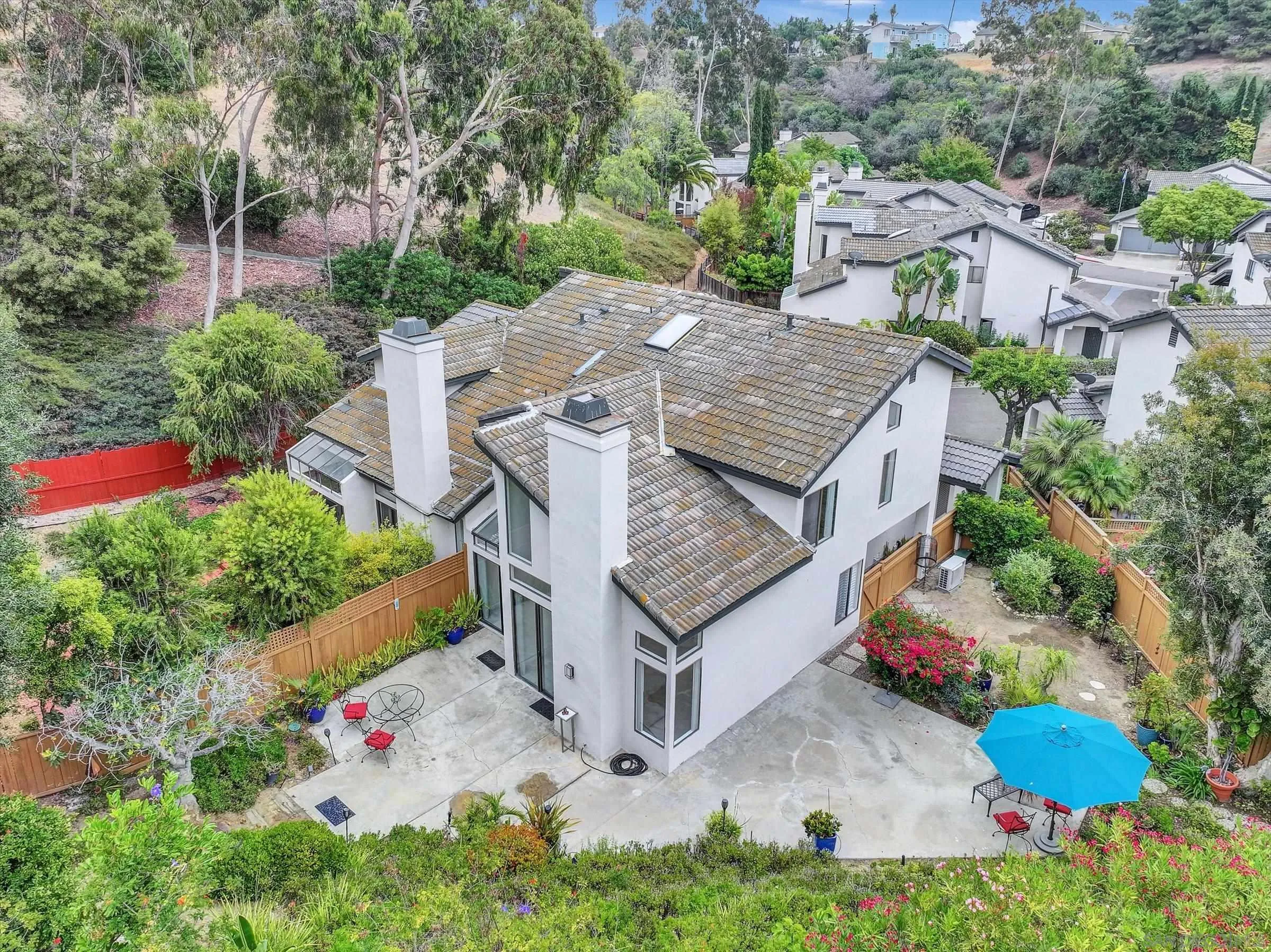 6426 Caminito Listo San Diego, CA 92111 - Photo 43 of 48 an aerial view of a house with a yard and potted plants