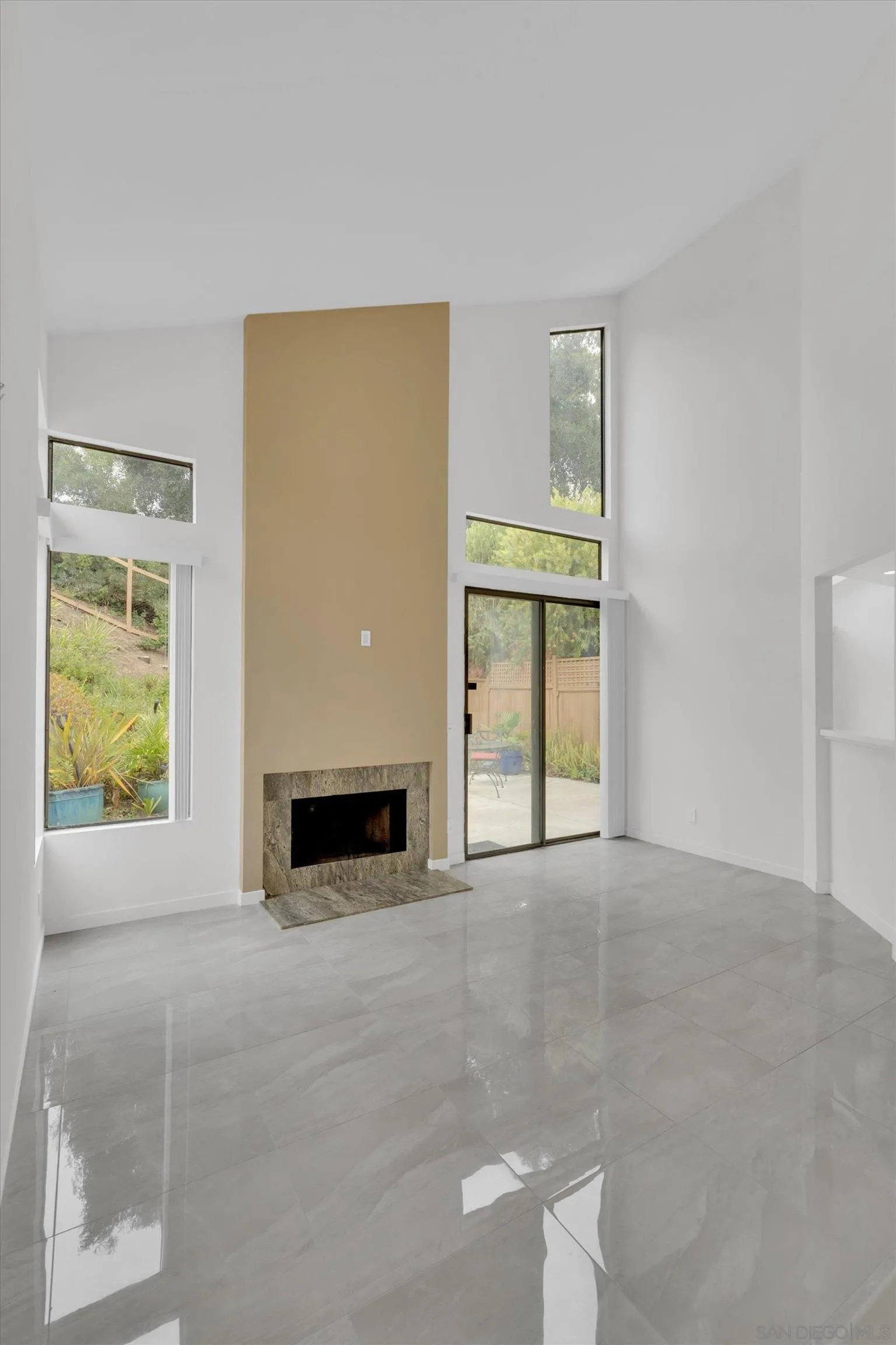 6426 Caminito Listo San Diego, CA 92111 - Photo 8 of 48 a view of an empty room with window and fire place