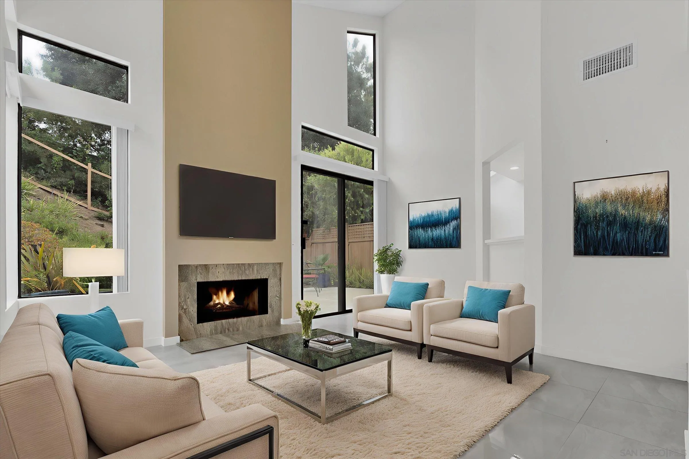 6426 Caminito Listo San Diego, CA 92111 - Photo 9 of 48 a living room with furniture and a fireplace