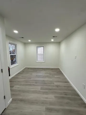 a view of kitchen with stainless steel appliances refrigerator microwave and cabinets