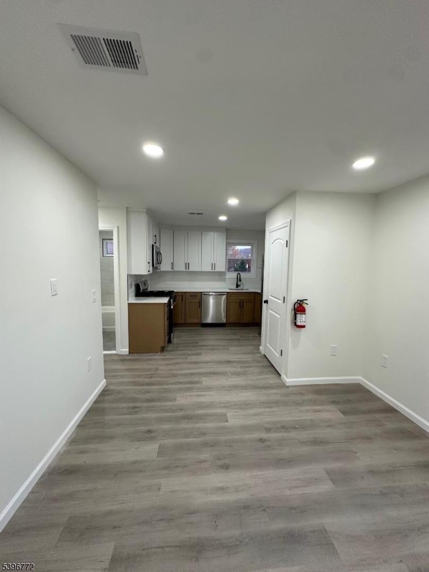 112 Fairview Avenue, Unit 2 Middlesex, NJ 08846 - Photo 15 of 29 a view of kitchen with stainless steel appliances refrigerator microwave and cabinets