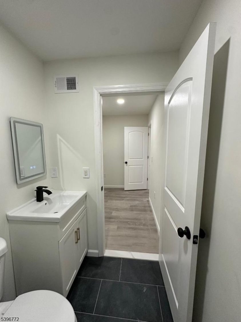 112 Fairview Avenue, Unit 2 Middlesex, NJ 08846 - Photo 24 of 29 a bathroom with a sink toilet and shower