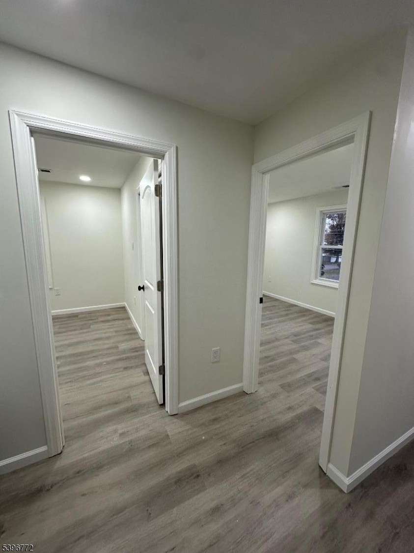 112 Fairview Avenue, Unit 2 Middlesex, NJ 08846 - Photo 26 of 29 a view of a hallway with wooden floor
