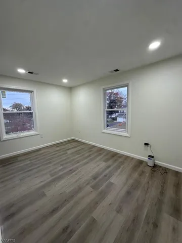 an empty room with window and windows