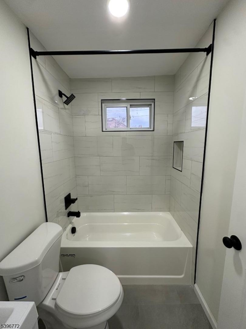 112 Fairview Avenue, Unit 2 Middlesex, NJ 08846 - Photo 10 of 29 a bathroom with a toilet and a bath tub