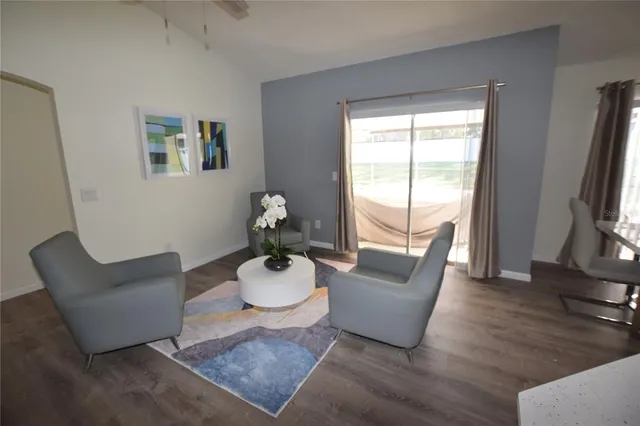 a living room with furniture and a table