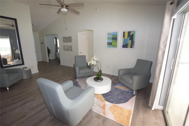 a living room with furniture and a table
