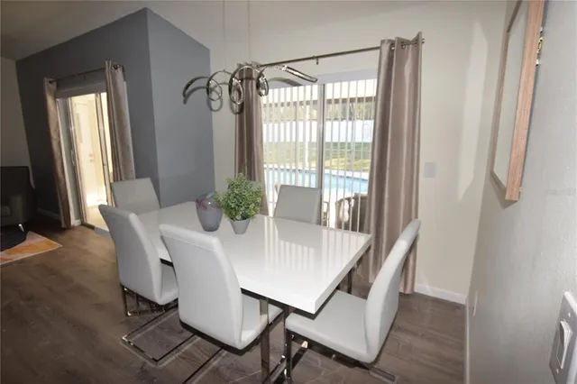 a dining room with furniture and window