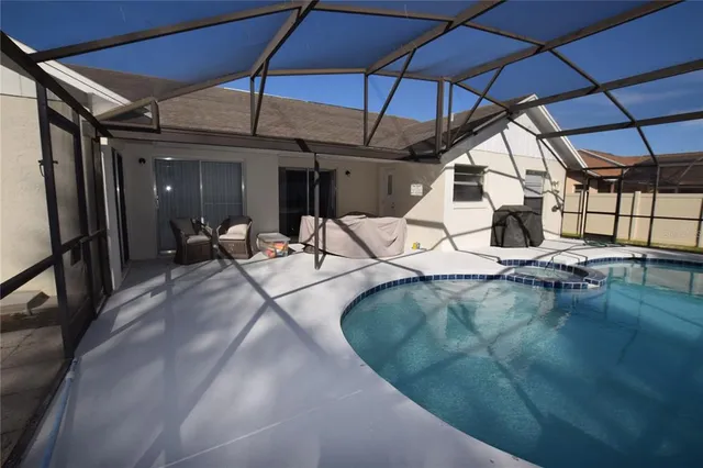 a view of a patio with a table and chairs