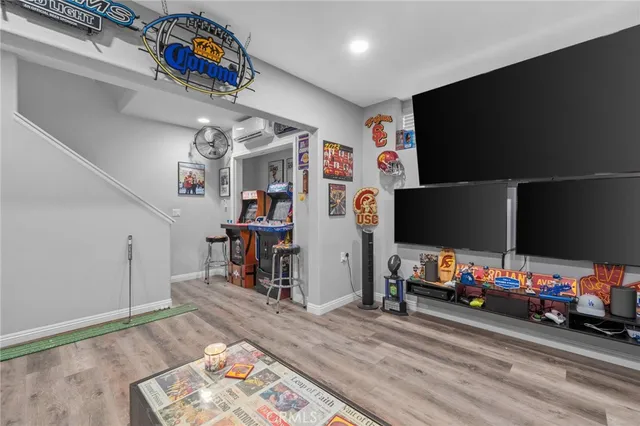 a view of a livingroom with furniture and a flat screen tv