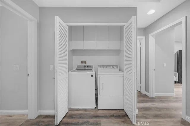 a view of storage and utility room with closet