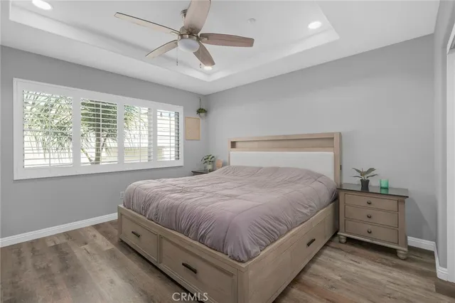 a spacious bedroom with a bed and a table